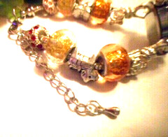 Hand assembled watch/bracelet with glass beads&silver tone charms&a watch