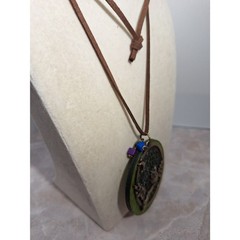 A Wood Disc Necklace With Owl Motif Leather Cord Whimsical Nature Inspired