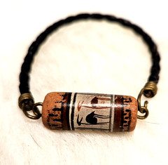 Peruvian One 1″ long bead, painted llamas, 6 3/4 inches long