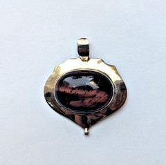 Sterling silver pendant featuring an oval striped gemstone