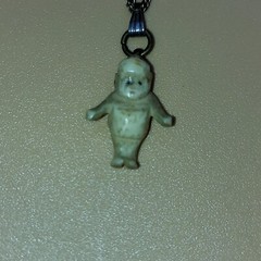 Strange Hand Carved Baby Necklace Tiny antique doll Kewpie charm vintage