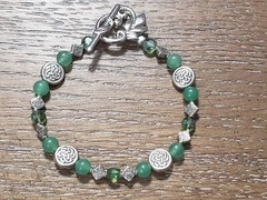 Handmade Bracelet Celtic knot charms, green glass beads & leafy toggle clasp