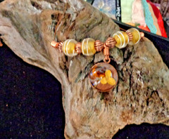 Artisan crafted, 15mm resin and dried flower pendant on strand of vintage yellow