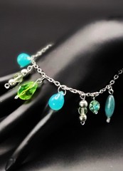 Uranium glass assorted bead charm? bracelet style on silver rolo chain 7″