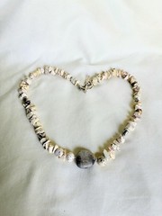 Handmade necklace with howlite beads a and Petoskey Stone in the middle