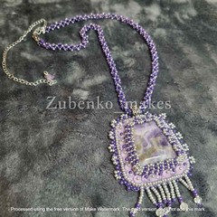 Elegant pendant with white and purple amethyst, beads and long beaded rope