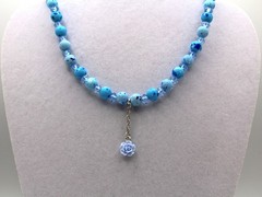 Handcrafted 21″ blue acrylic beads with dangling flower charm necklace