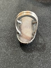 Sterling silver ring with reddish Brown oval center stone. Size 5-5 1/4.