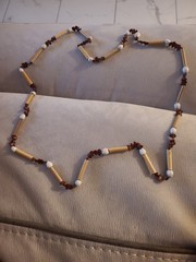 Natural materials necklace with bamboo tubes, seeds, and shell beads