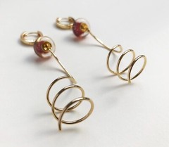 Unmatched earrings dangle, large spiral earrings gold tone