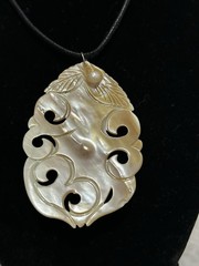 Mother Of Pearl Carved Pendant Necklace On Black Cord