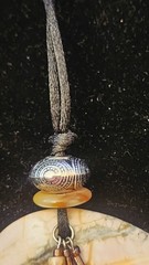 Artisan Carved Picasso Stone Bear Pendant With Silver Charm Feathers