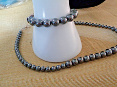 Artisan crafted 18” graduated Hematite necklace and bracelet on black silk. Silv