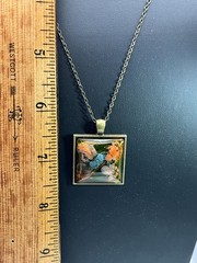 Custom rectangle jewel pendant in bronze, orange, blue & brown on bronze chain