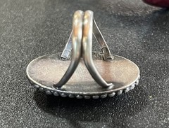Sterling silver ring with reddish Brown oval center stone. Size 5-5 1/4.