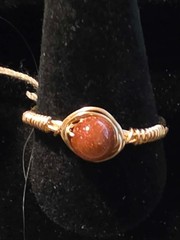 Handmade sizes 4 – 15 Wire-Wrapped Goldstone Rings with Gold-Tone Plated Wire