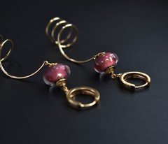 Unmatched earrings dangle, large spiral earrings gold tone