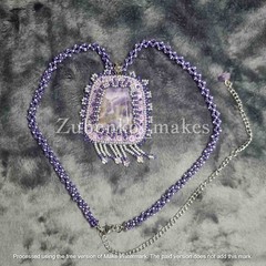 Elegant pendant with white and purple amethyst, beads and long beaded rope