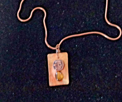 Artisan crafted 1 1/4×34” hammered copper tag with antique button and tiger eye