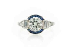 Features A Central 1.13CT Round European Cut CZ With Blue Sapphire Art Deco Ring