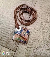 Retro Caribbean swirly glass necklace, handcrafted on a brown ribbon!