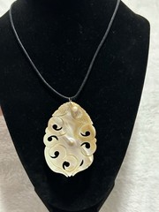 Mother Of Pearl Carved Pendant Necklace On Black Cord