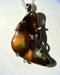 Fire agate pendant, Slaughter Mtn AZ .75x 1.25” 20 Ct. Set In Silver Plate Brass