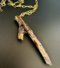 Handmade one of a kind jewelry made from real pieces of wood coated in resin