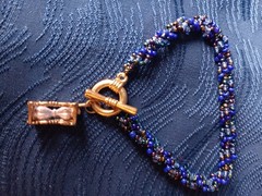 Handmade Blue Beaded Bracelet With Toggle Clasp And Hourglass Charm