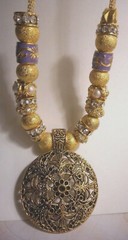 Beautiful one of a kind hand assembled necklace with gold tone beads & charms
