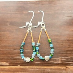 Boho style glass beaded earrings with leather and silver accents