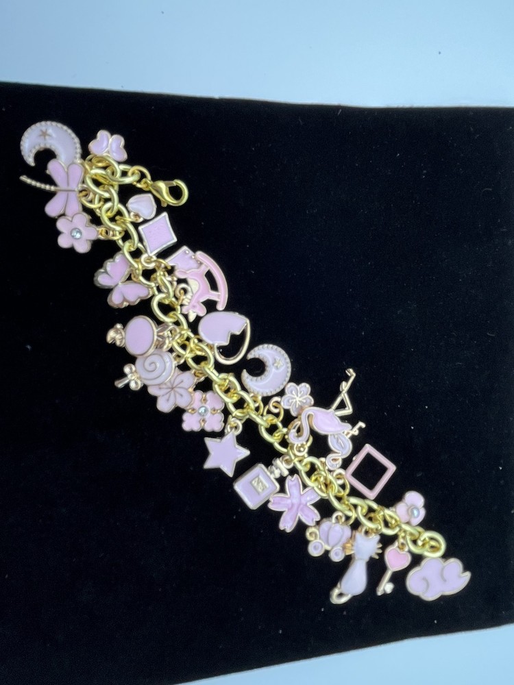 Charm Bracelet 7 inches with many pink charms costume jewelry