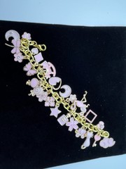 Charm Bracelet 7 inches with many pink charms costume jewelry