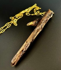 Handmade one of a kind jewelry made from real pieces of wood coated in resin