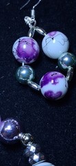 Handcrafted white and purple floral patterned Glass bead bracelet earring set.