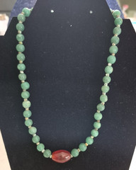 Green aventurine beads and a central orange stone necklace 18in