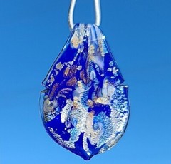 Women’s Glass Pendant. 18″ to 19″ Long. Blue, Silver, Yellow, and Copper.