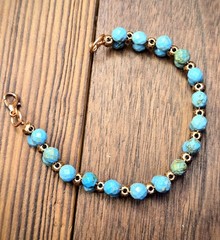 The Frontier’s Genuine Faceted Turquoise In Handwoven Antique Copper Bracelet