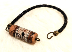 Peruvian One 1″ long bead, painted llamas, 6 3/4 inches long