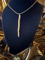 One of a kind jewelry made from real pieces of wood coated in resin