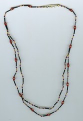 Blue, red, gold, black beaded necklace. A touch of blue!