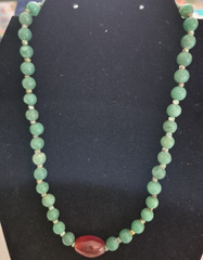 Green aventurine beads and a central orange stone necklace 18in