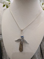 handcrafted necklace features an angel pendant made from a vintage silverplate s