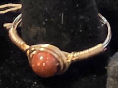 Handmade sizes 4 – 15 Wire-Wrapped Goldstone Rings with Gold-Tone Plated Wire