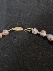 A Handmade 19 Inch Purple And Gold Necklace With 18 Carat Gold Plated Clasp