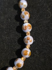 A Handmade 19 Inch Purple And Gold Necklace With 18 Carat Gold Plated Clasp