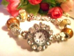 Hand assembled watch/bracelet with glass beads&silver tone charms&a watch