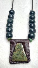 Serpentine on leather hand braided and adjustable Necklace with Guatemala Jade.