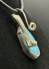 Handcrafted Natural Earth-Mined Turquoise Pendant set in Silver Filigree.