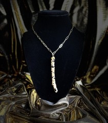 One of a kind jewelry made from real pieces of wood coated in resin